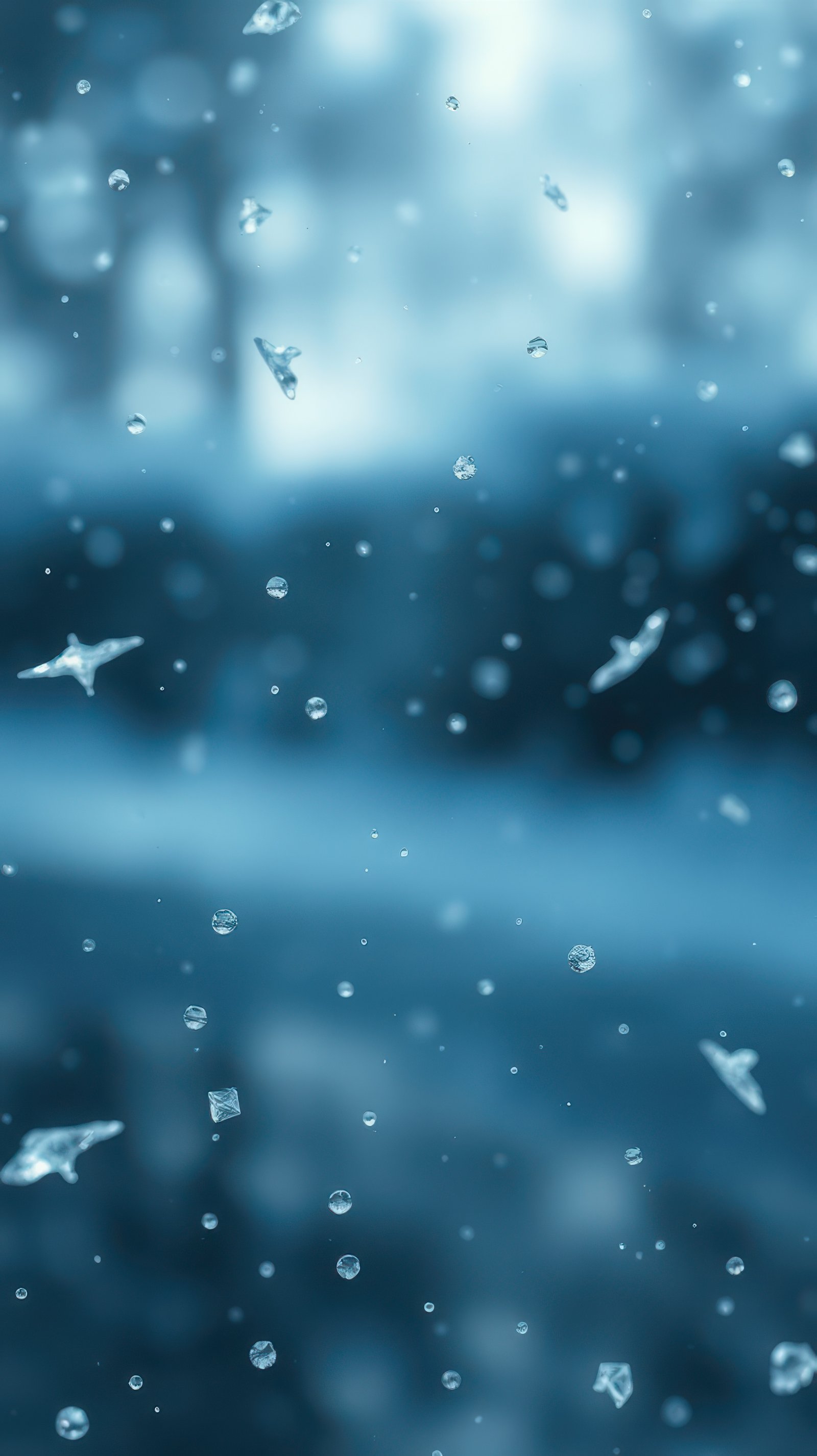Water droplets fall gracefully as the camera captures the serene atmosphere of a rainy day in a tranquil setting